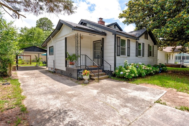 1915 Hawthorne St, Savannah, GA 31404 - view of front of home with a chimney and concrete driveway