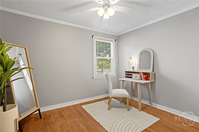 1915 Hawthorne St, Savannah, GA 31404 - sitting room featuring wood finished floors, a textured ceiling, ceiling fan, and crown molding