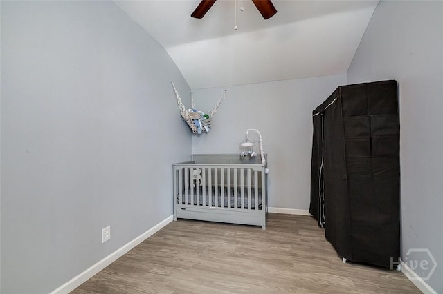 251 Old Louisville Rd, Guyton, GA 31312 - bedroom with lofted ceiling, light wood-style flooring, a nursery area, and ceiling fan