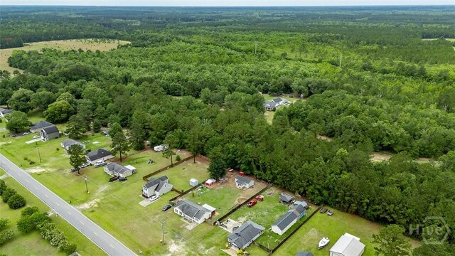 251 Old Louisville Rd, Guyton, GA 31312 - aerial overview of property's location with a heavily wooded area