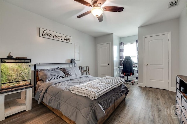 251 Old Louisville Rd, Guyton, GA 31312 - bedroom with wood finished floors, ceiling fan, and an office area