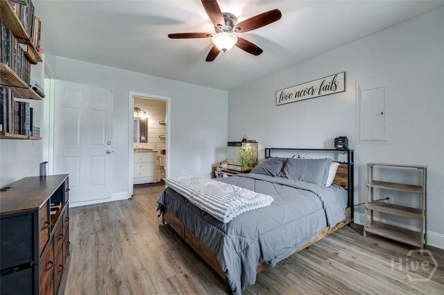 251 Old Louisville Rd, Guyton, GA 31312 - bedroom with light wood-type flooring, ensuite bathroom, and a ceiling fan