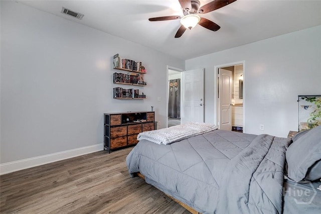 251 Old Louisville Rd, Guyton, GA 31312 - bedroom with wood finished floors, ensuite bathroom, and a ceiling fan