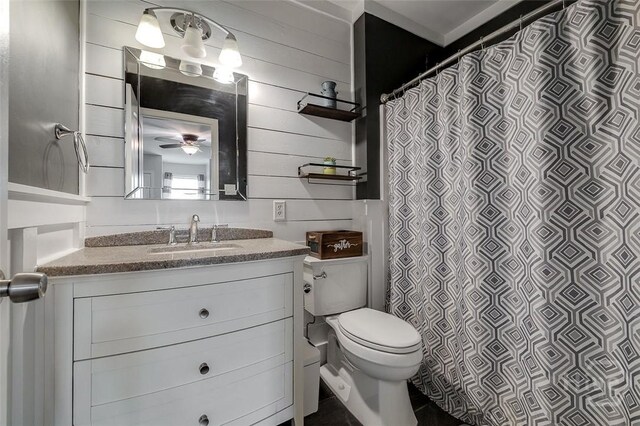 251 Old Louisville Rd, Guyton, GA 31312 - bathroom with vanity, wood walls, ceiling fan, and curtained shower