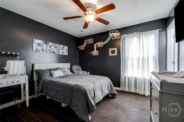 251 Old Louisville Rd, Guyton, GA 31312 - bedroom with wood finished floors, a textured ceiling, and ceiling fan