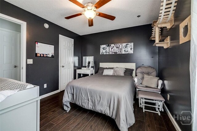 251 Old Louisville Rd, Guyton, GA 31312 - bedroom with wood finished floors, a textured ceiling, ceiling fan, and a closet