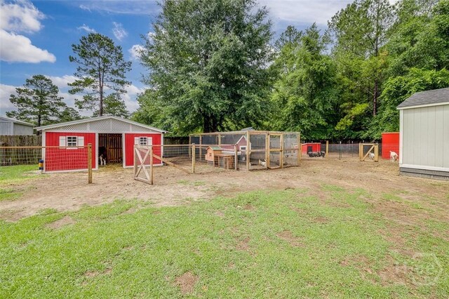 251 Old Louisville Rd, Guyton, GA 31312 - view of yard featuring exterior structure and an outdoor structure