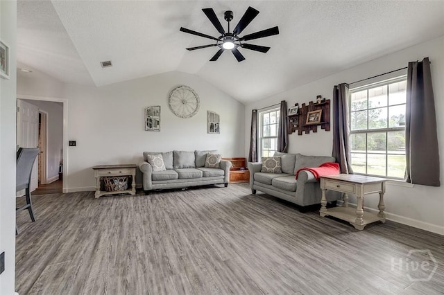 251 Old Louisville Rd, Guyton, GA 31312 - living room featuring ceiling fan, vaulted ceiling, wood finished floors, and healthy amount of natural light