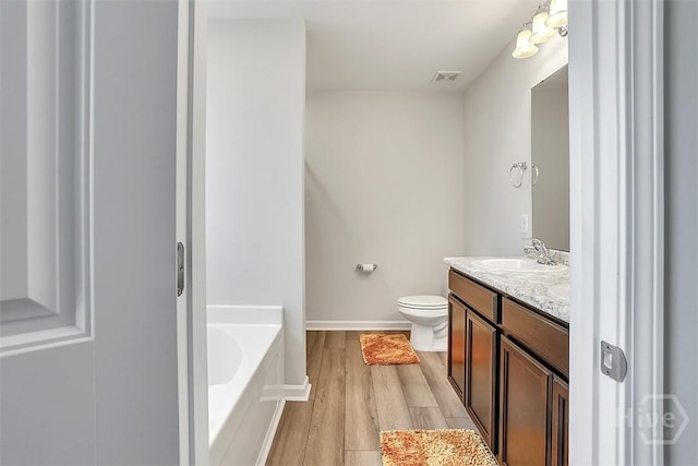72 Marsh Salt Ln, Port Wentworth, GA 31407 - bathroom with a bath, vanity, and wood finished floors