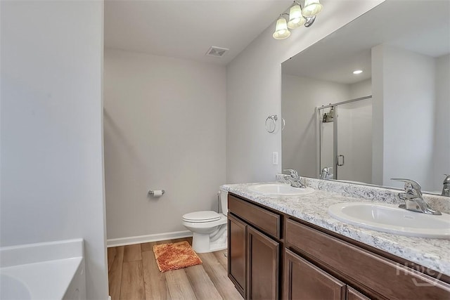 72 Marsh Salt Ln, Port Wentworth, GA 31407 - full bath with a shower stall, double vanity, wood finished floors, and a bathtub