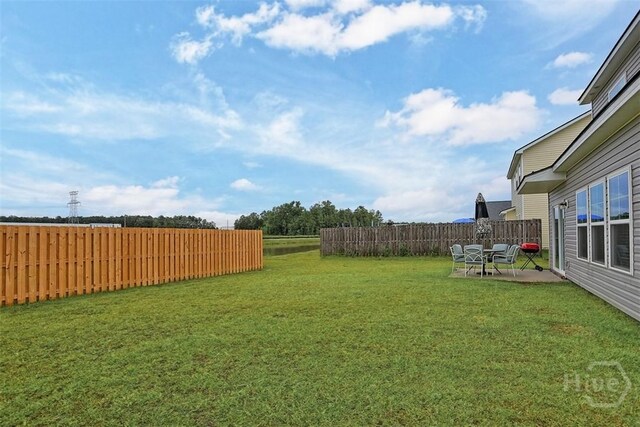 72 Marsh Salt Ln, Port Wentworth, GA 31407 - fenced yard with a patio area