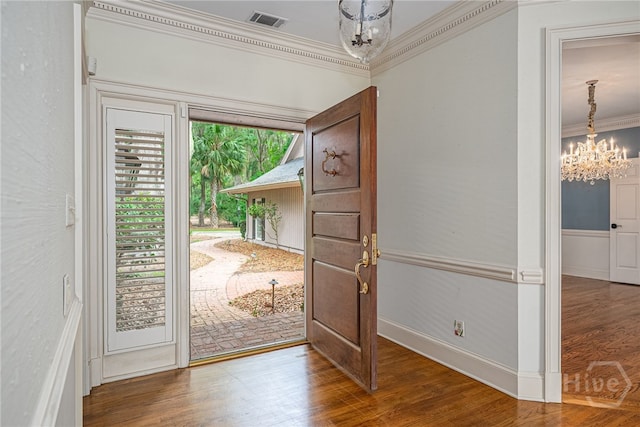 4 Hedgewood Ln, Savannah, GA 31411 - foyer with a chandelier, ornamental molding, and wood finished floors
