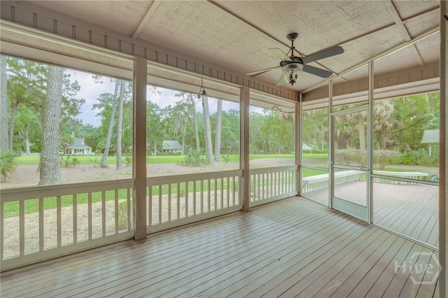 4 Hedgewood Ln, Savannah, GA 31411 - unfurnished sunroom featuring ceiling fan and view of wooded area