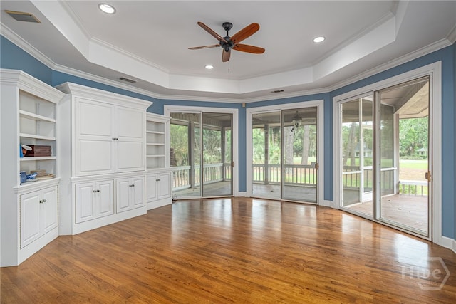 4 Hedgewood Ln, Savannah, GA 31411 - unfurnished room featuring a raised ceiling, a ceiling fan, wood finished floors, crown molding, and recessed lighting