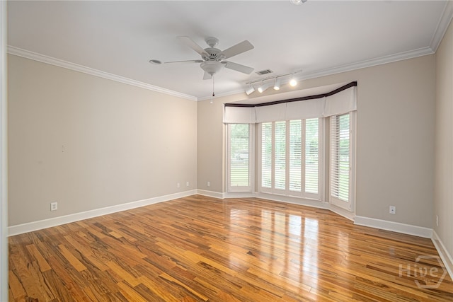 4 Hedgewood Ln, Savannah, GA 31411 - unfurnished room featuring rail lighting, a ceiling fan, wood finished floors, and crown molding