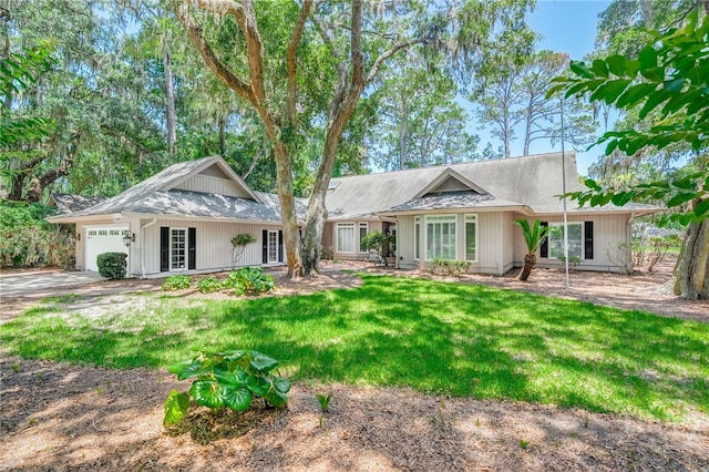 4 Hedgewood Ln, Savannah, GA 31411 - ranch-style house with an attached garage, a front lawn, and concrete driveway