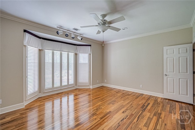 4 Hedgewood Ln, Savannah, GA 31411 - spare room with track lighting, ceiling fan, light wood finished floors, and crown molding