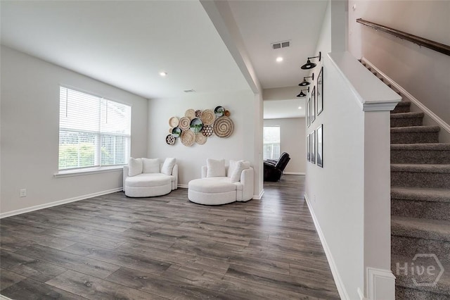 151 Excel Dr, Richmond Hill, GA 31324 - living area with plenty of natural light, dark wood finished floors, stairs, and recessed lighting