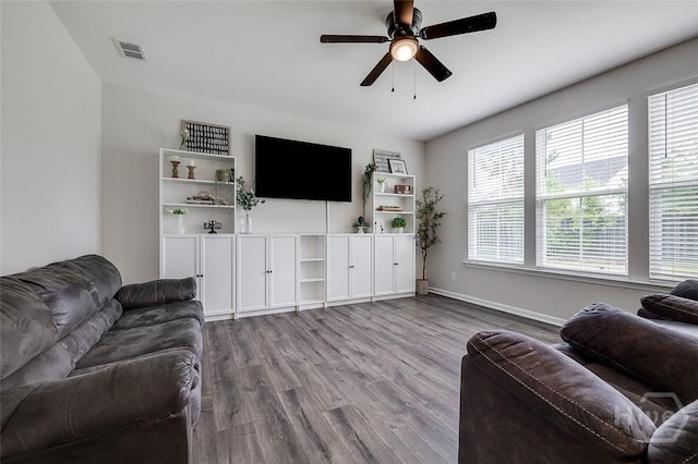 151 Excel Dr, Richmond Hill, GA 31324 - living area with wood finished floors and a ceiling fan