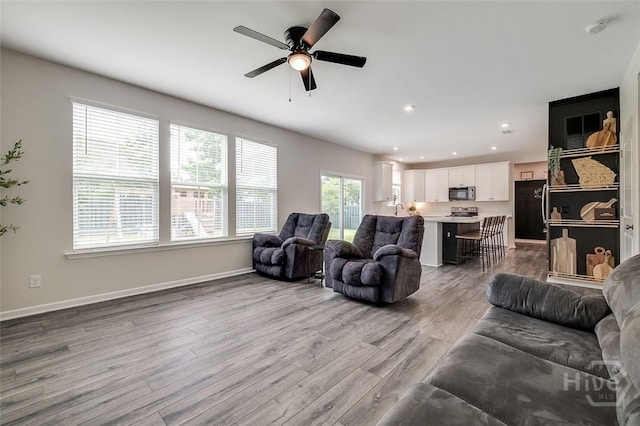 151 Excel Dr, Richmond Hill, GA 31324 - living area featuring wood finished floors, a ceiling fan, and recessed lighting