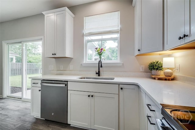 151 Excel Dr, Richmond Hill, GA 31324 - kitchen featuring dishwasher, healthy amount of natural light, white cabinets, and light countertops