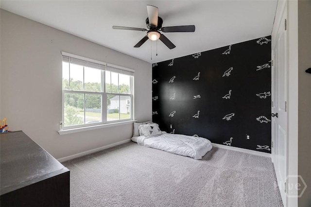 151 Excel Dr, Richmond Hill, GA 31324 - carpeted bedroom with baseboards and ceiling fan