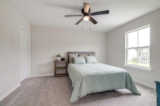 151 Excel Dr, Richmond Hill, GA 31324 - carpeted bedroom featuring baseboards and ceiling fan