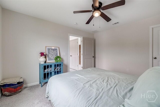 151 Excel Dr, Richmond Hill, GA 31324 - carpeted bedroom with baseboards and ceiling fan