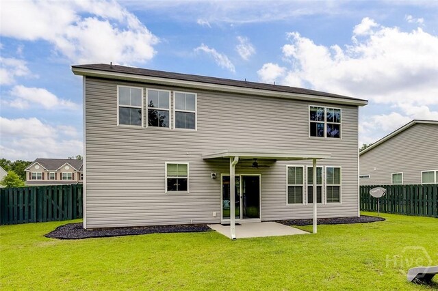 151 Excel Dr, Richmond Hill, GA 31324 - back of house with ceiling fan, a fenced backyard, and a patio area