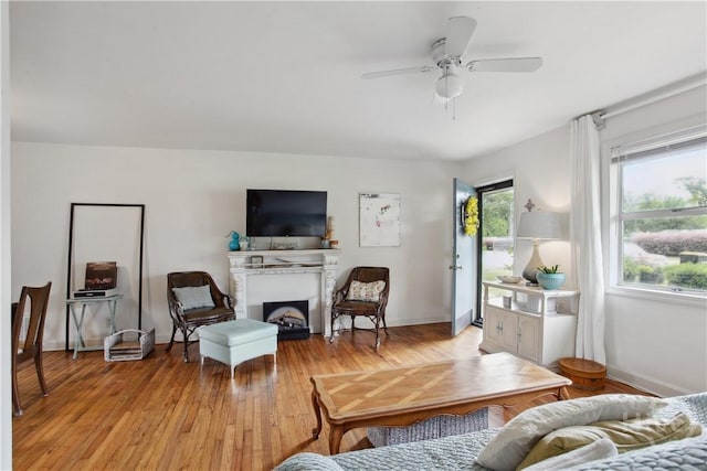 2104 Mason Dr, Savannah, GA 31404 - living area with a fireplace, light wood-type flooring, and a ceiling fan