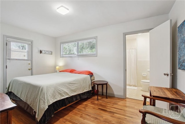 2104 Mason Dr, Savannah, GA 31404 - bedroom featuring multiple windows, light wood-type flooring, and ensuite bathroom