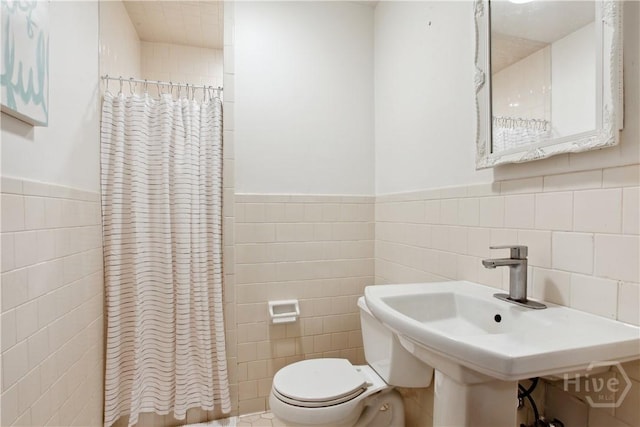 2104 Mason Dr, Savannah, GA 31404 - full bathroom with tile walls, a shower with shower curtain, and wainscoting