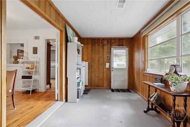 2104 Mason Dr, Savannah, GA 31404 - foyer entrance with wood walls and finished concrete floors