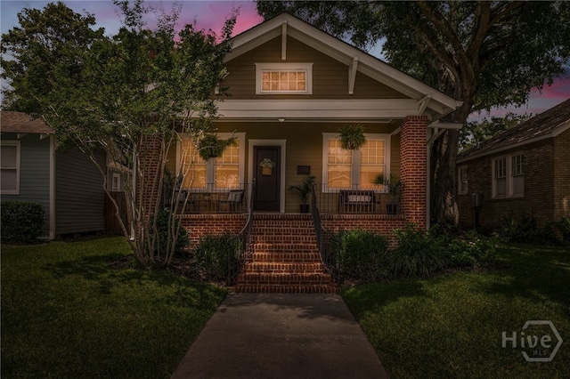 316 E 51st St, Savannah, GA 31405 - bungalow with a front yard, a porch, and stairs