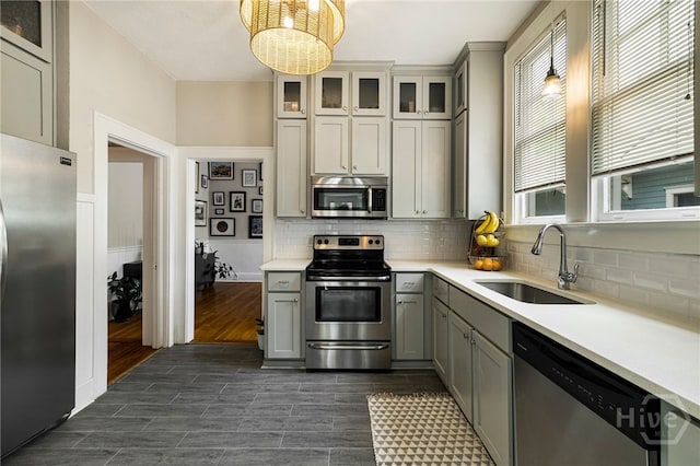 316 E 51st St, Savannah, GA 31405 - kitchen featuring appliances with stainless steel finishes, gray cabinetry, healthy amount of natural light, and light countertops