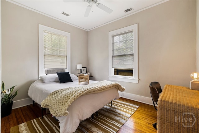 316 E 51st St, Savannah, GA 31405 - bedroom featuring multiple windows, crown molding, wood finished floors, ceiling fan, and a desk