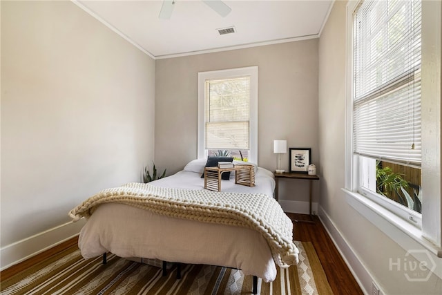 316 E 51st St, Savannah, GA 31405 - bedroom featuring crown molding, dark wood-style flooring, and a ceiling fan