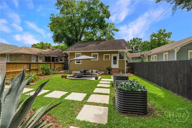 316 E 51st St, Savannah, GA 31405 - rear view of house featuring outdoor lounge area, entry steps, and a fenced backyard