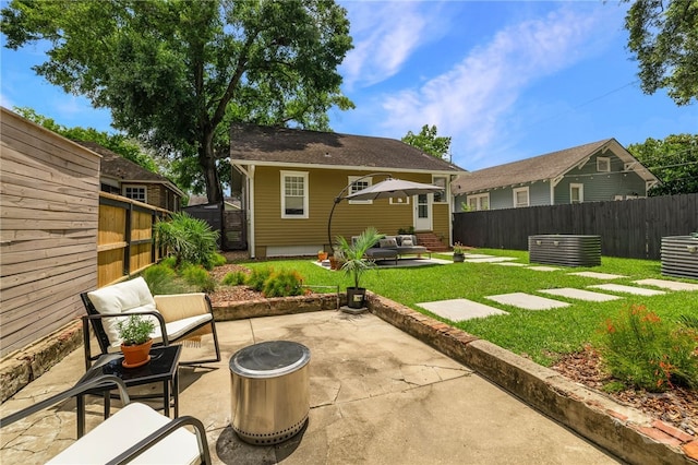 316 E 51st St, Savannah, GA 31405 - fenced backyard with an outdoor living space with a fire pit, a patio, and entry steps