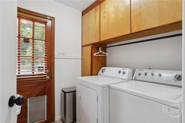 5527 Habersham St, Savannah, GA 31405 - laundry area with cabinet space, washer and clothes dryer, and healthy amount of natural light