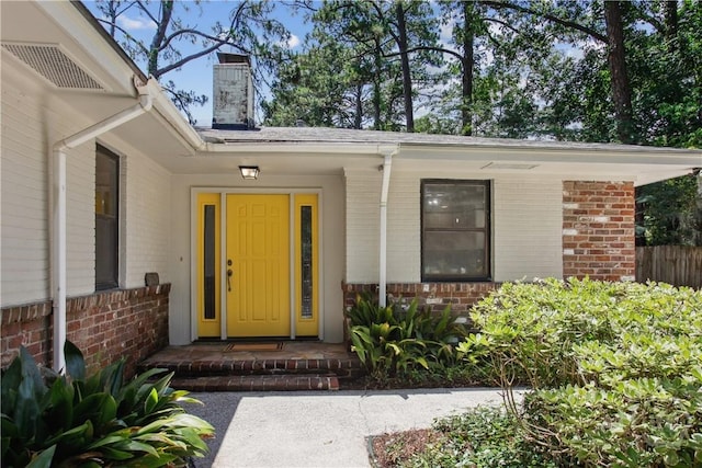 5527 Habersham St, Savannah, GA 31405 - property entrance featuring brick siding and a chimney