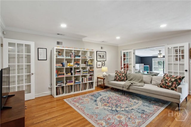5527 Habersham St, Savannah, GA 31405 - living room featuring french doors, wood finished floors, crown molding, a ceiling fan, and recessed lighting