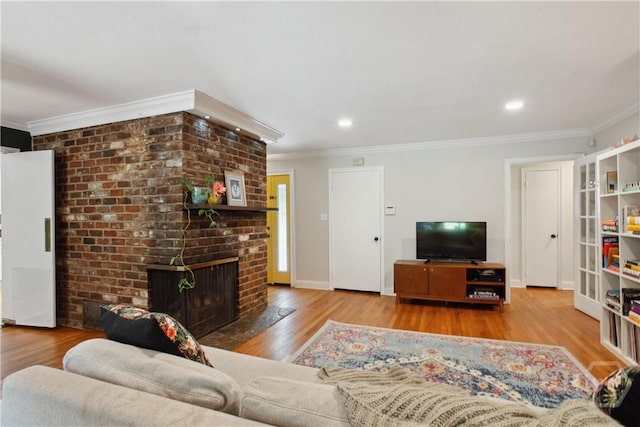 5527 Habersham St, Savannah, GA 31405 - living area featuring wood finished floors, crown molding, a fireplace, and recessed lighting