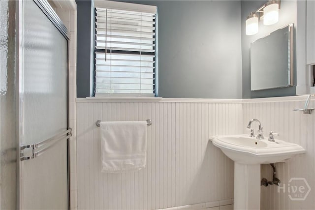 5527 Habersham St, Savannah, GA 31405 - bathroom featuring wainscoting, a shower stall, and healthy amount of natural light