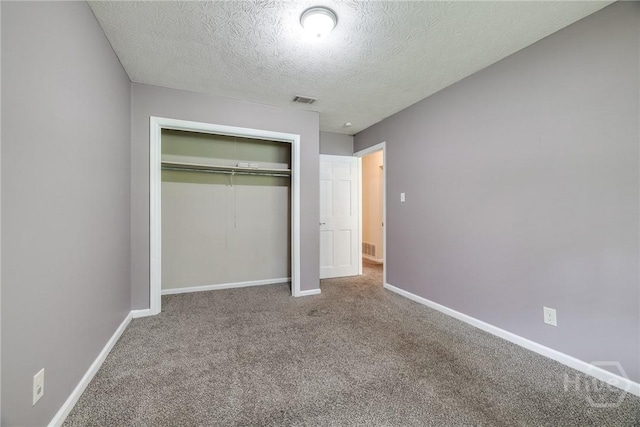 41 Barrington Cir, Savannah, GA 31419 - unfurnished bedroom featuring a closet, carpet flooring, and a textured ceiling