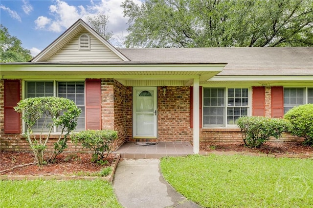 41 Barrington Cir, Savannah, GA 31419 - single story home with brick siding, a front yard, and a porch