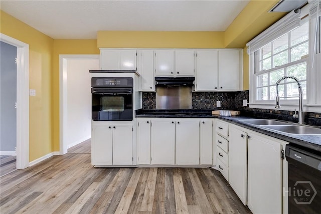 41 Barrington Cir, Savannah, GA 31419 - kitchen featuring black appliances, under cabinet range hood, white cabinets, and dark countertops