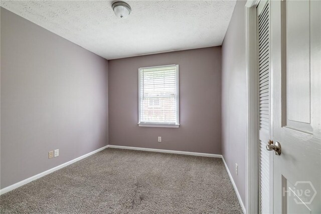 41 Barrington Cir, Savannah, GA 31419 - carpeted empty room featuring baseboards and a textured ceiling