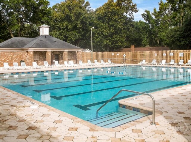 41 Barrington Cir, Savannah, GA 31419 - community pool with a patio area and view of scattered trees