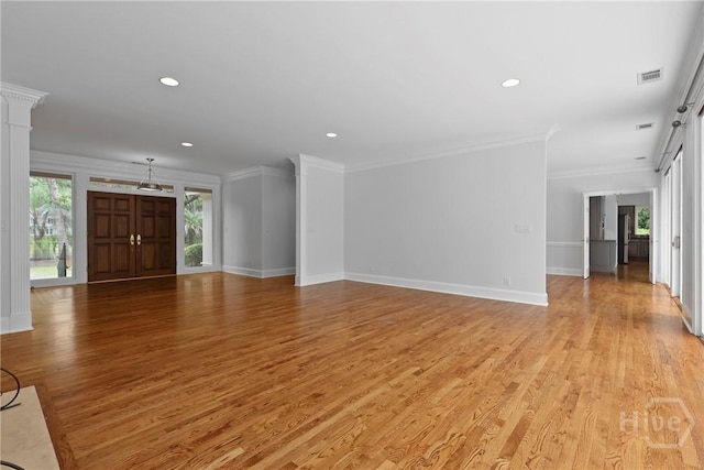 8 Boars Nest Ln, Savannah, GA 31411 - unfurnished living room with light wood-type flooring, recessed lighting, and crown molding
